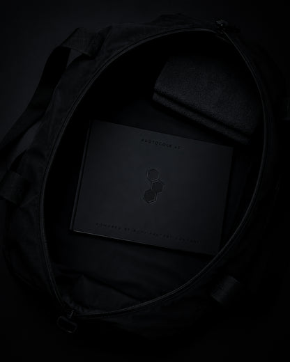 Carnet d’entraînement PROTOCOLE 42 rangé dans un sac de sport noir.